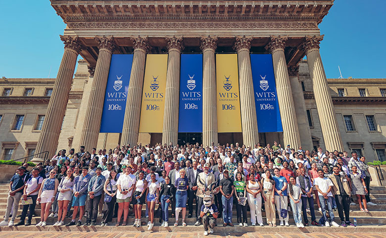 Top performing Wits applicants take a group photo on the steps of the Great Hall